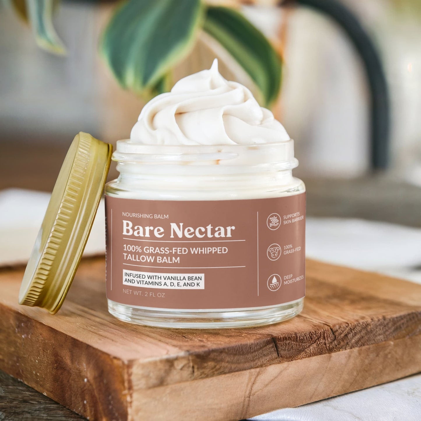 Bare Nectar Grass Fed Whipped Tallow Balm on a wooden board surface