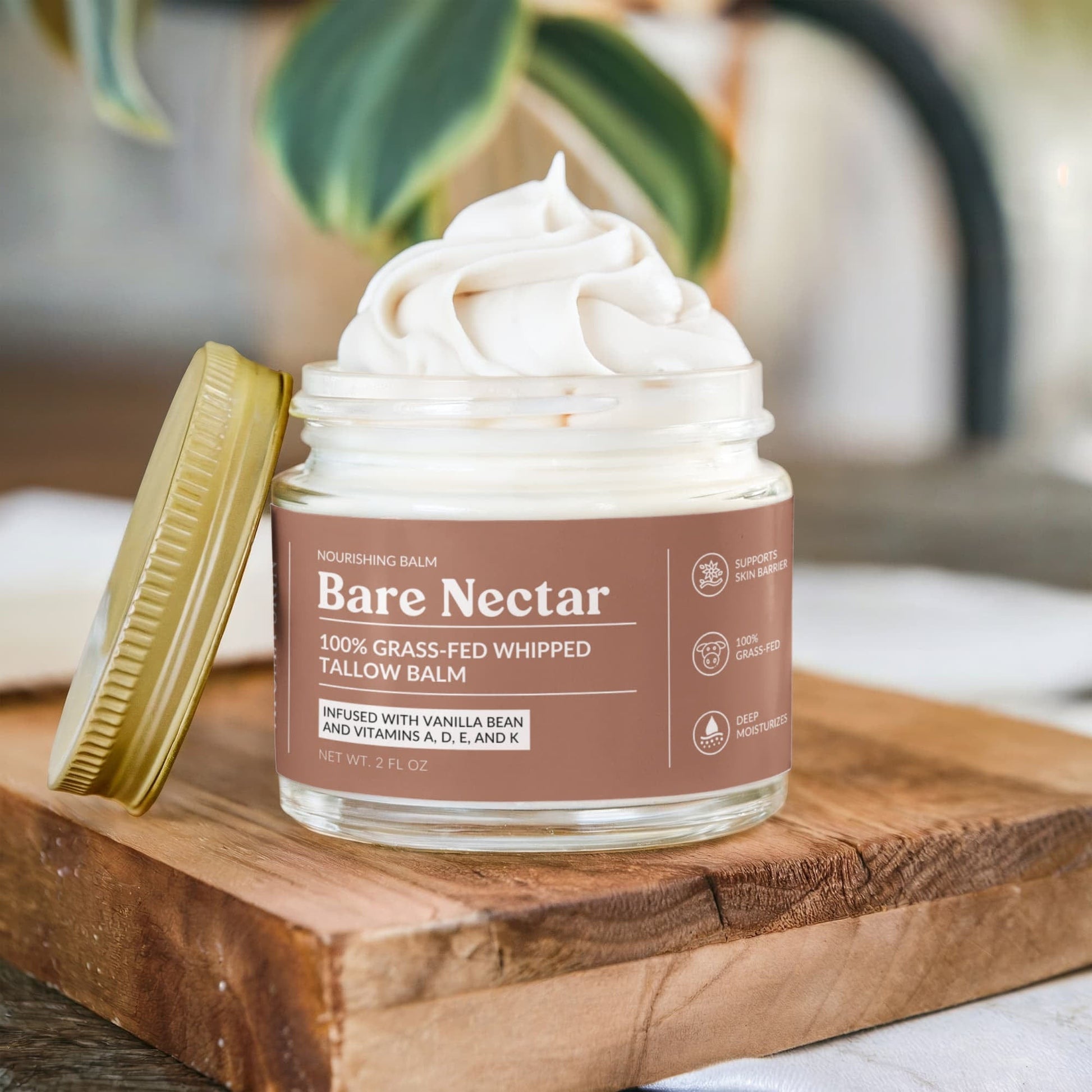 Bare Nectar Grass Fed Whipped Tallow Balm on a wooden board surface